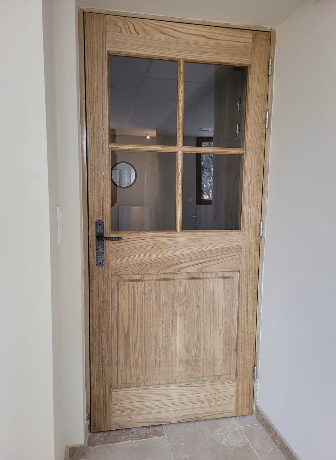 Porte vitrée en chêne à petits bois